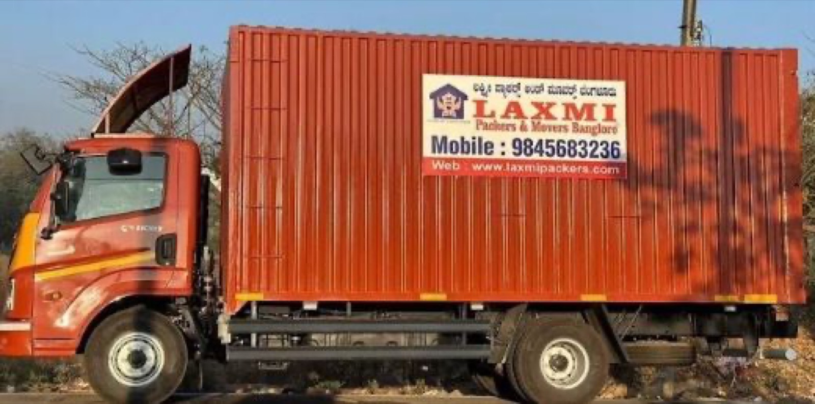 Laxmi Packers and Movers branded container truck in Bangalore