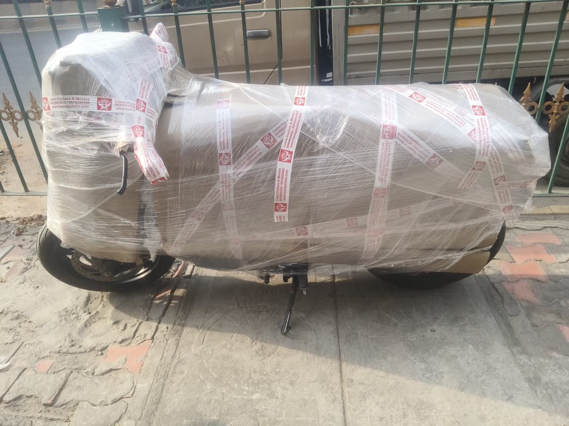 BMW bike transportation service from Bangalore to Guwahati by Laxmi Packers and Movers