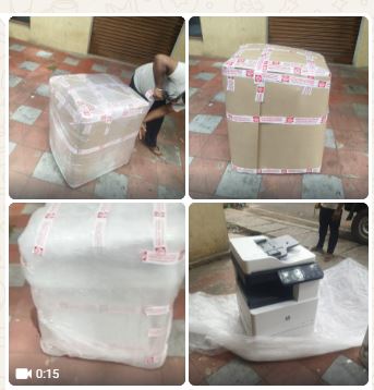 Professional packing of a large delicate printer using protective wrapping by Laxmi Packers and Movers Bangalore